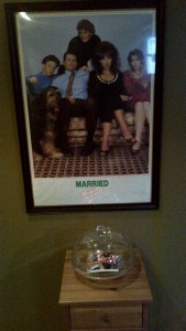 The family...and of course the sacred book of bundyisms under protective cake tray glass.